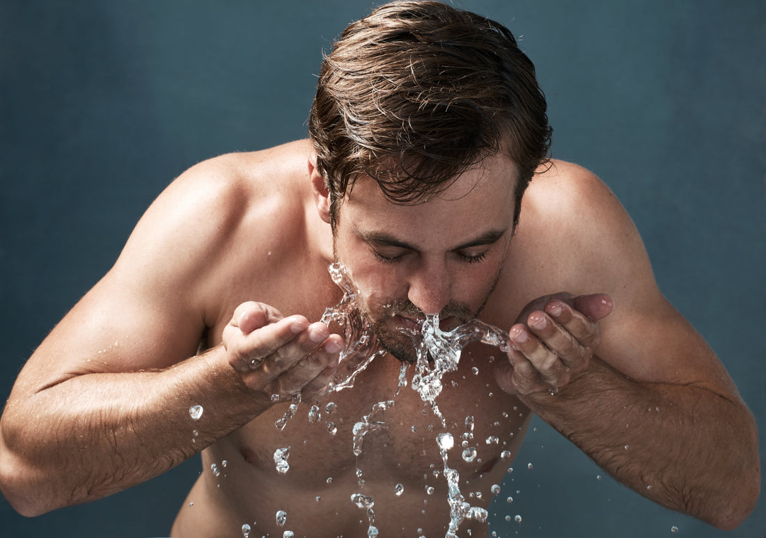 White man washing his face
